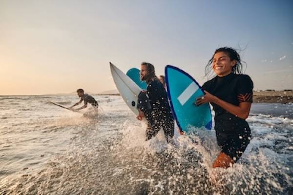 Surfers with Boards Friends surfing at Cocoa Beach