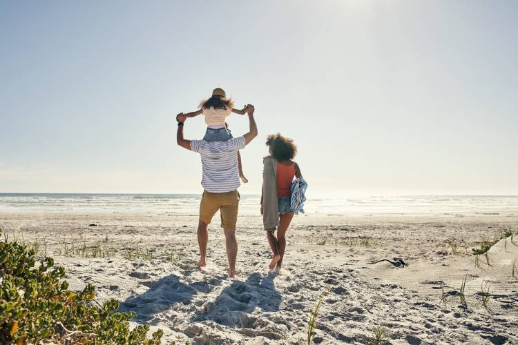 family walking on the florida beach