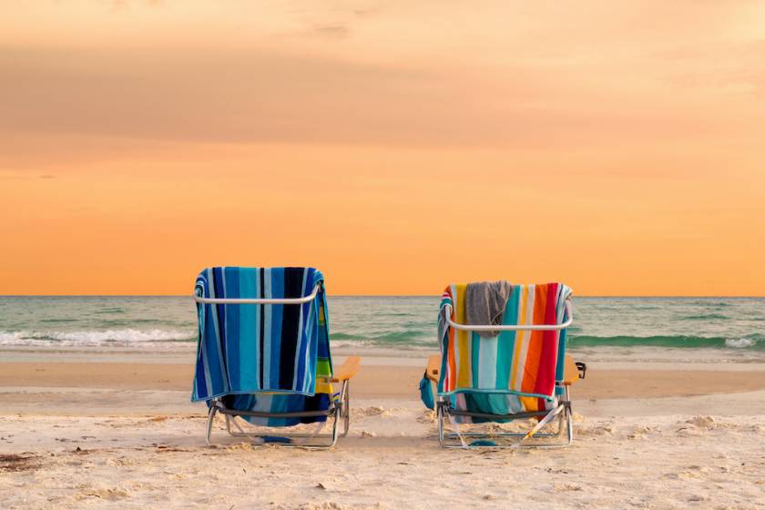Cocoa Beach beach chairs in sand